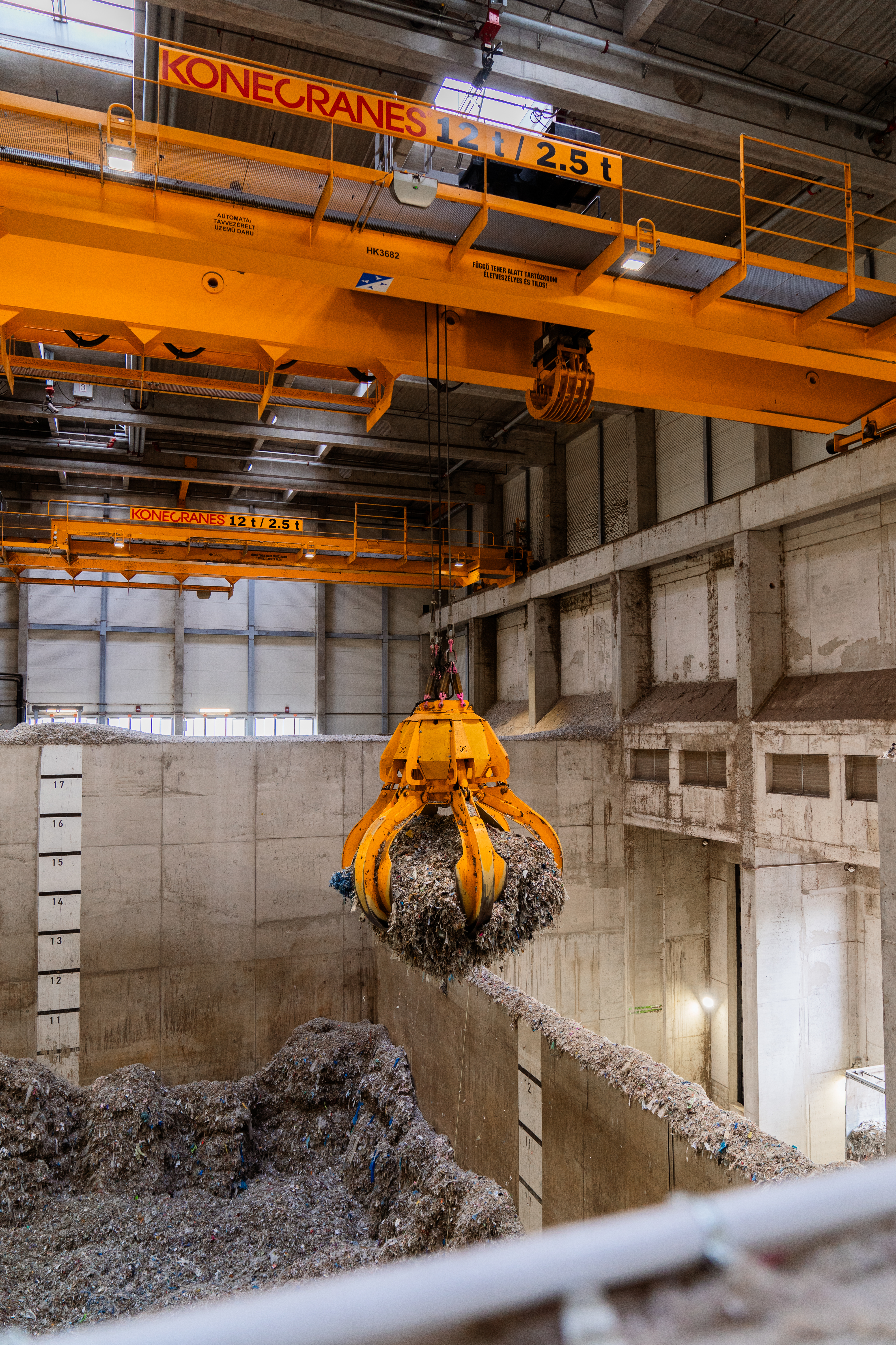An image of a grabber lifting paper mass