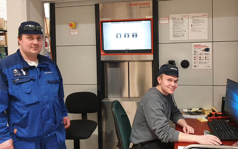 Juustoportti maintenance workers in front of Agilon system