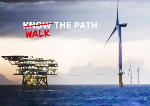 Windmill on the sea with text "Know the path" but know overlined and replaced with walk