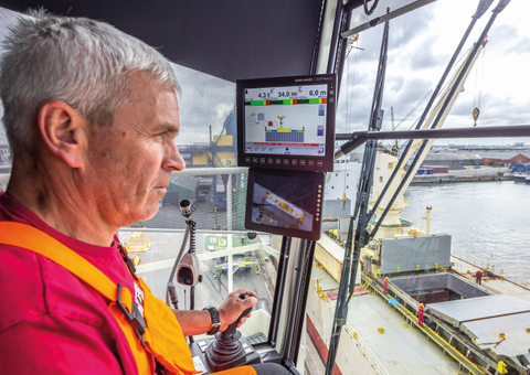 Operator in Mobile harbor crane cabin