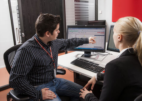 People looking at computer