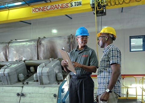 Technician and customer with crane