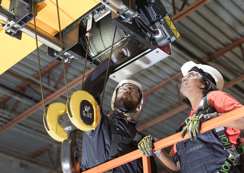 Konecranes service technicians inspecting a crane