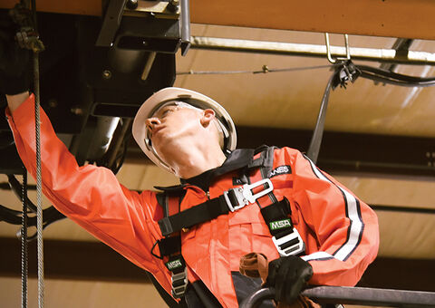 Konecranes technician inspecting crane