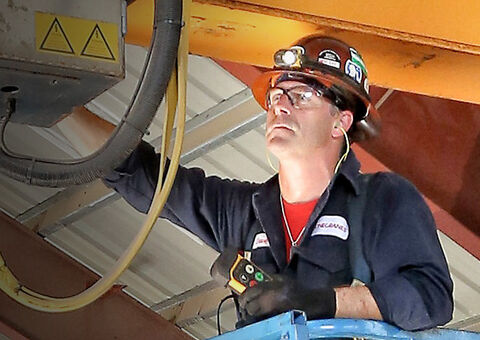 Konecranes technician repairing crane