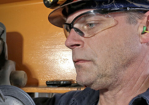 Technician servicing crane