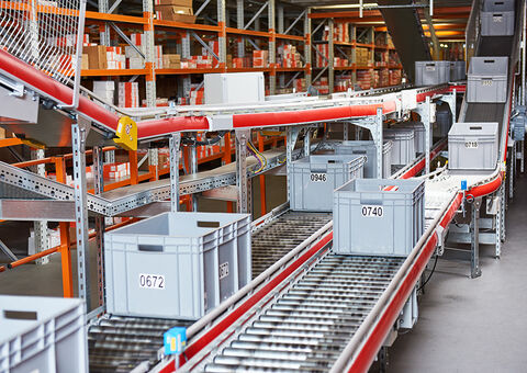 Boxes traveling by conveyor