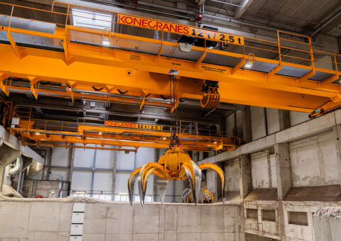 Waste handling crane in paper mill