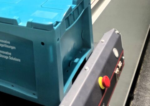 Agilon infeed and outfeed with a roller conveyor and Konecranes-branded BITO LEO AGV.