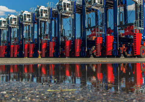 Konecranes Noell Sprinter Carriers lined up outside.