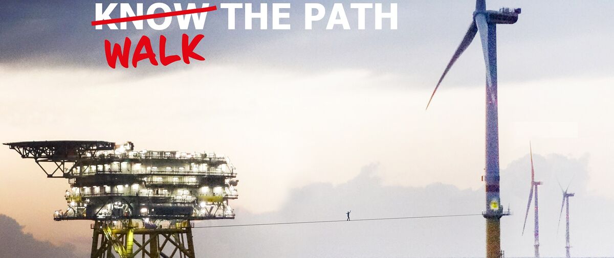 Windmill on the sea with text "Know the path" but know overlined and replaced with walk