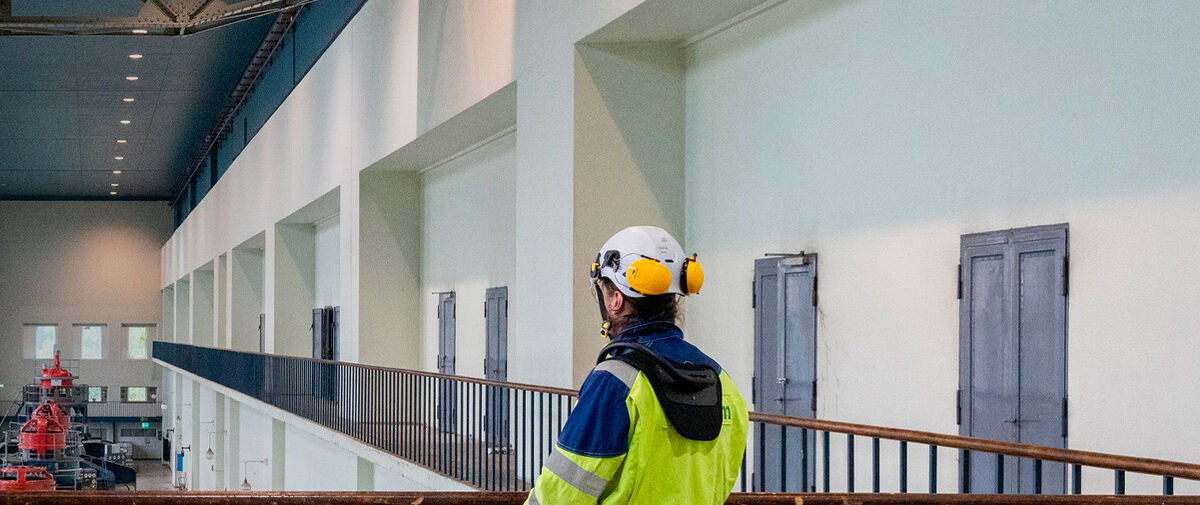 Crane operator viewing an overhead crane at hydro power plant