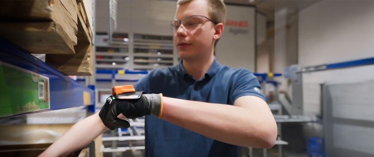Worker doing inventory in warehouse