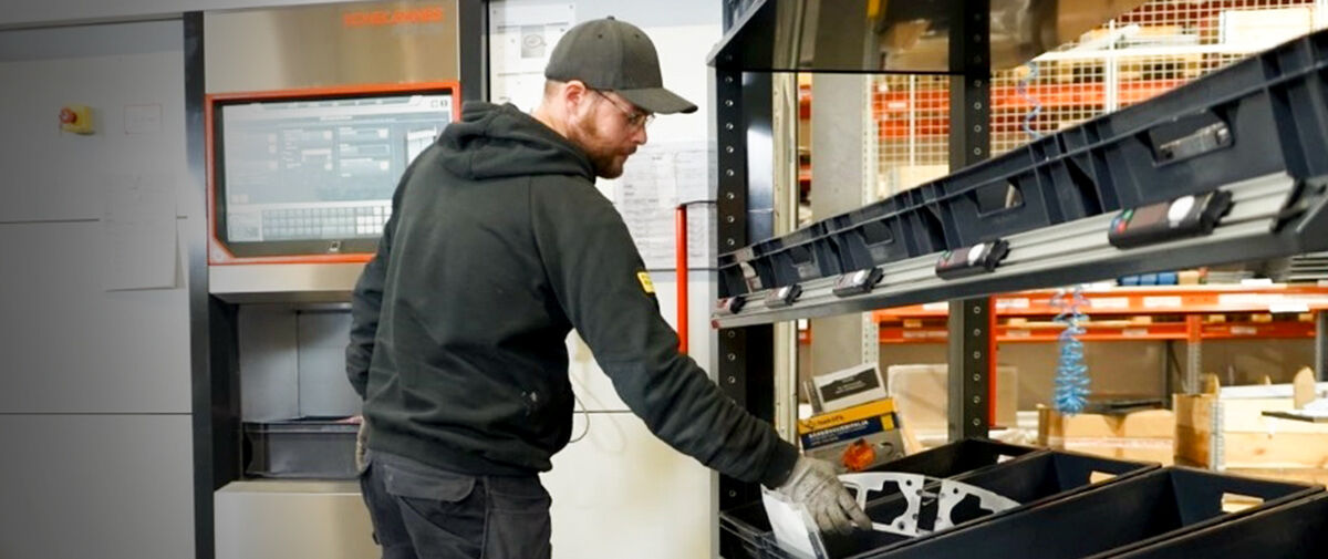 Worker in front of Agilon system