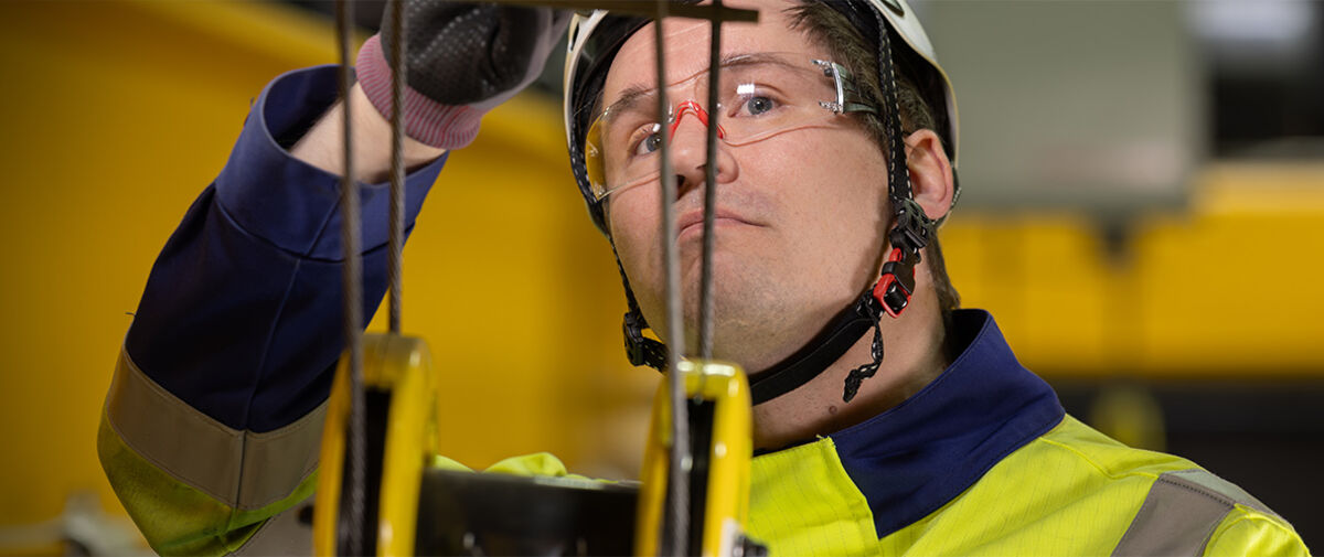 Konecranes technician inspecting crane