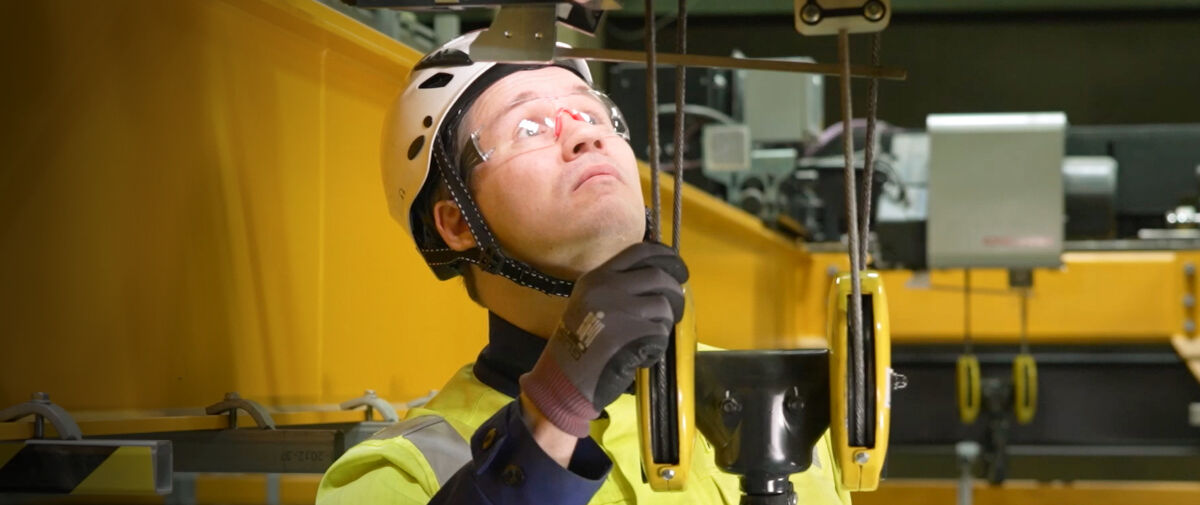 Technician looking at hoist