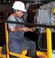 Konecranes technician works on overhead crane