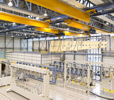 Interlocking crane lifting aircraft wing