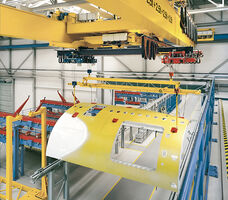 Overhead crane lifting plane part