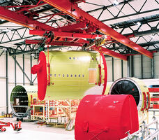 Overhead crane turning fuselage section