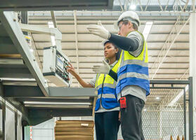 Workers in automated warehouse